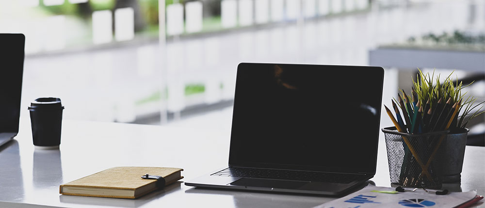 a photo of a laptop computer on a desk