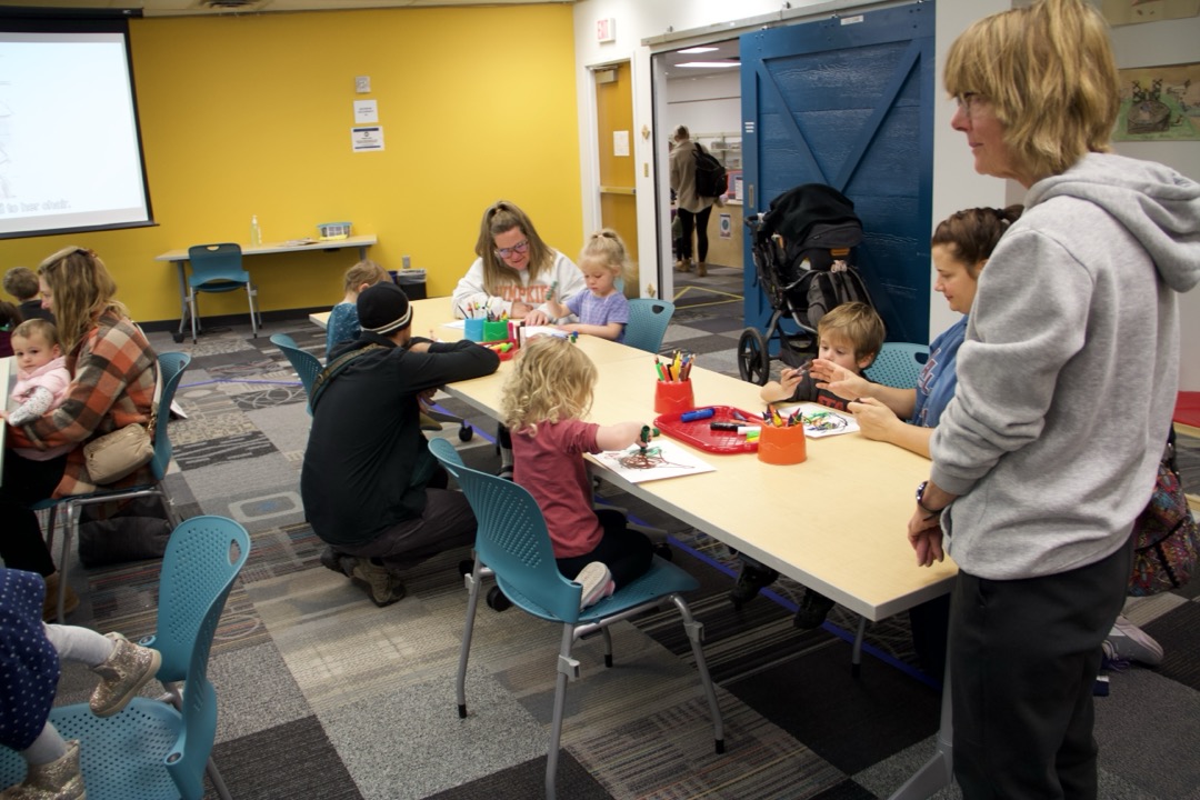 Kids Gathered in the library and drawing in a Create & Play Event