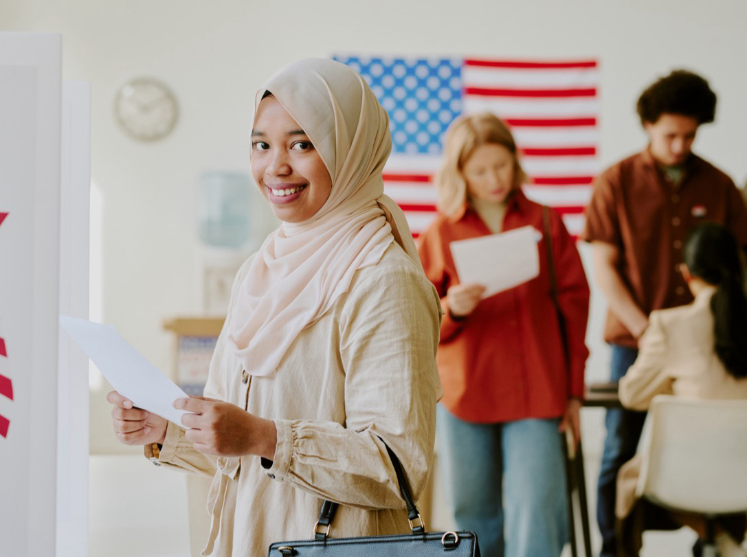 Cheerful Muslim woman with piece of paper in her hand