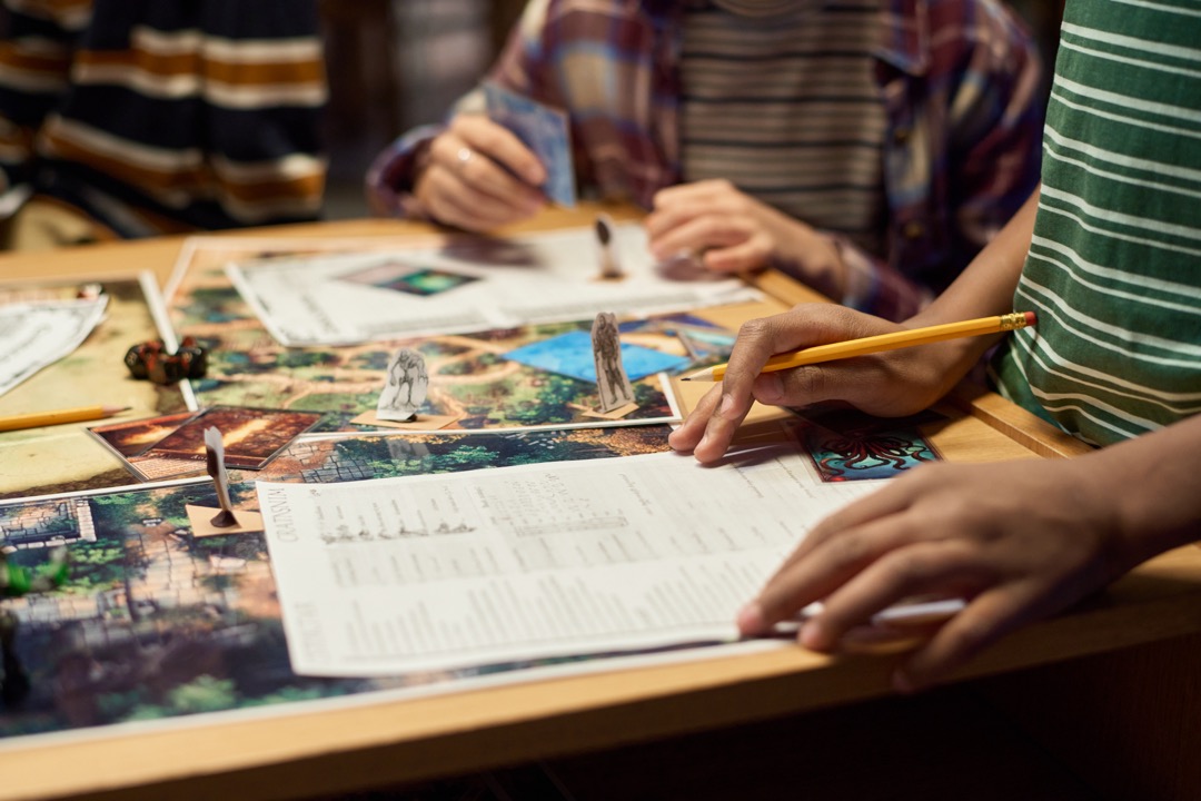 Teens playing DND on a table