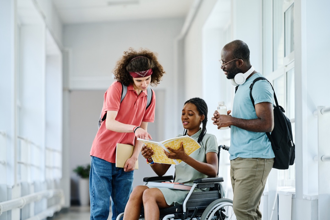 Teens Talking among each other in a hallway