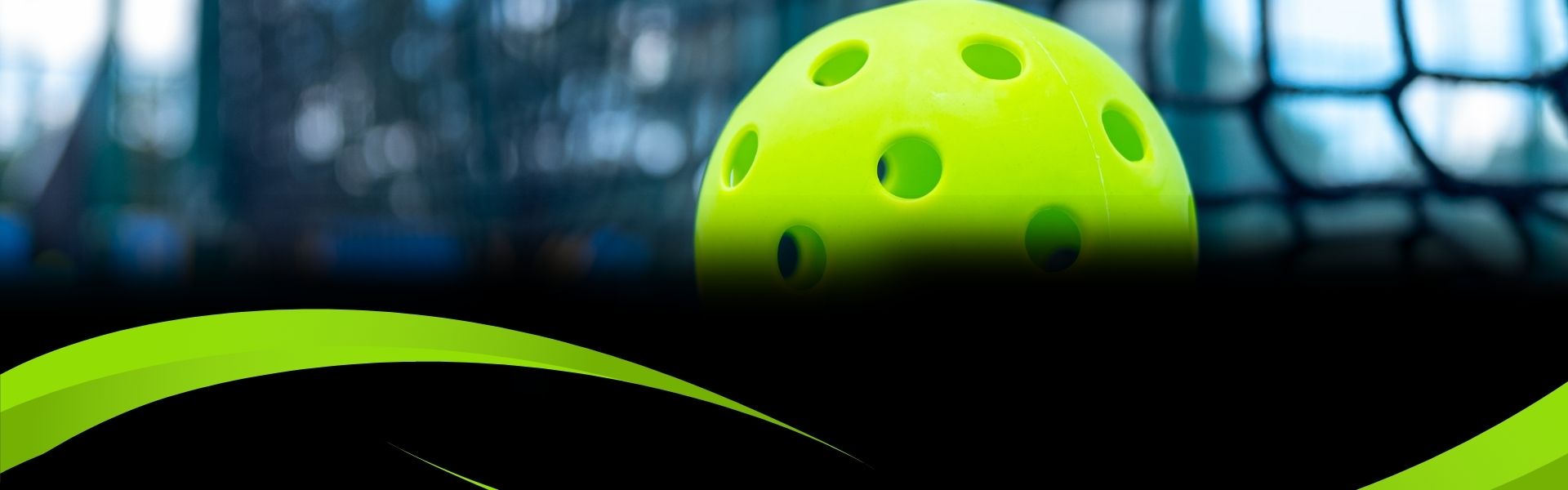 A green ball with holes hitting a net