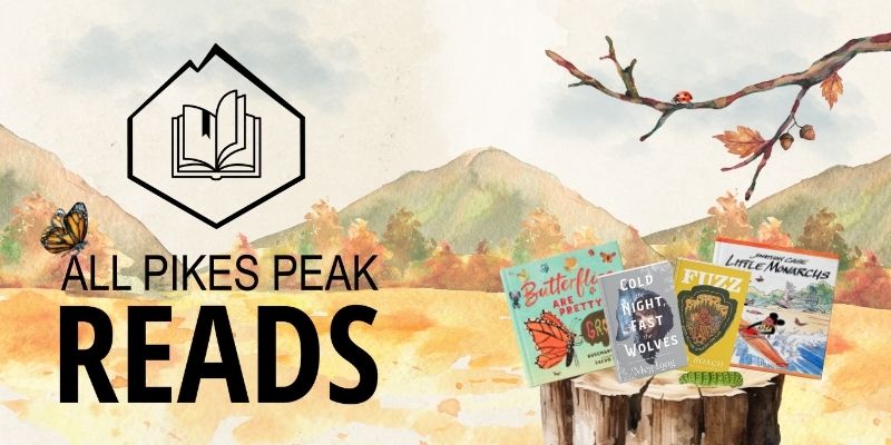 A watercolor painting of a landscape with mountains in the background. A caterpillar, ladybug, and butterfly climb on trees, walk in front of this year’s books, or fly over text that says, “All Pikes Peak Reads.”