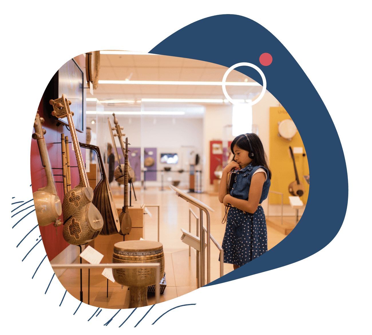 A young girl with a blue dress at a museum viewing art