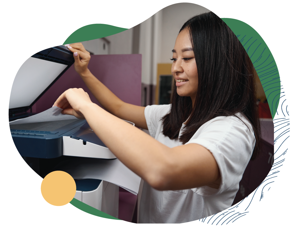 A women using the printing within the library