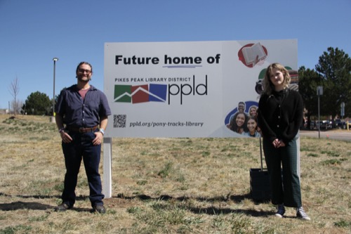 A group of people gathered around the sign that says "Future home of PPLD"