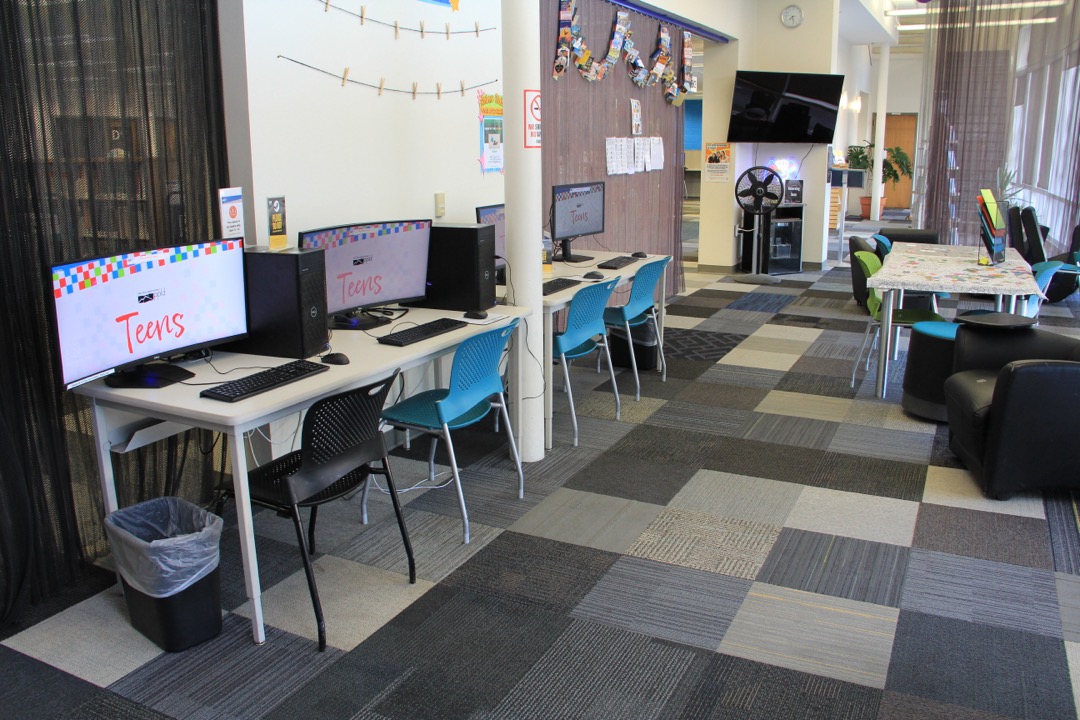 Game Center in the Penrose Library featuring computers and a tv monitor