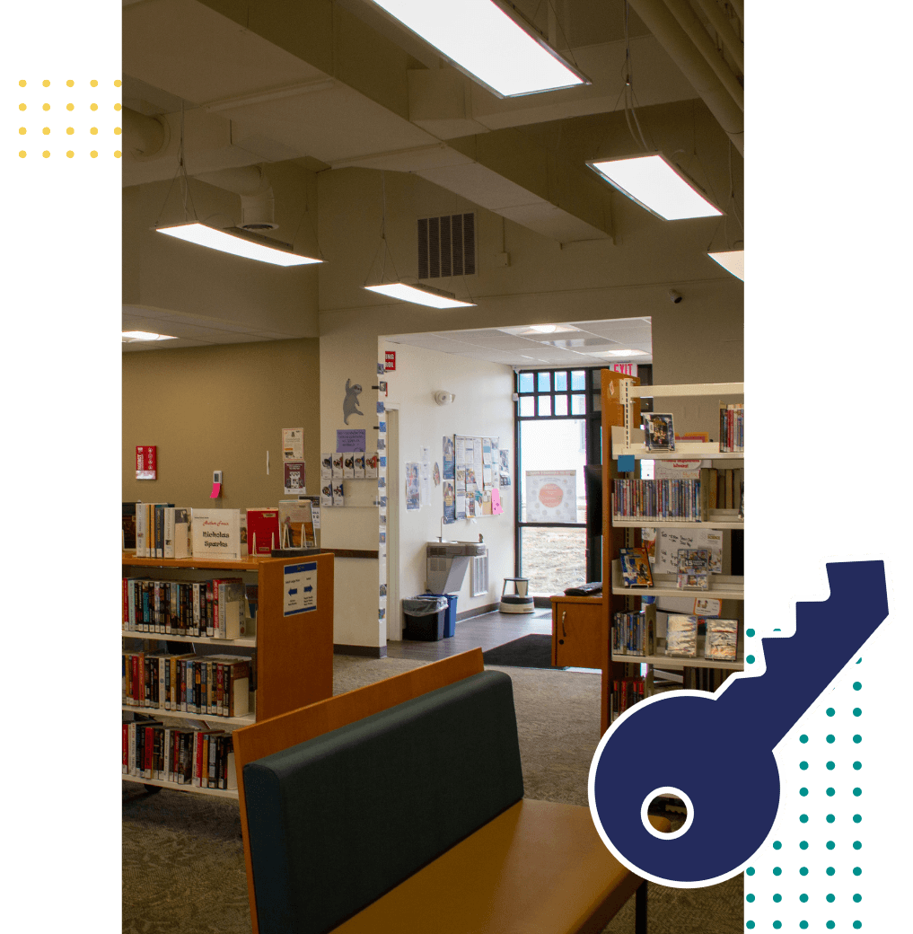 Interior hallway within Calhan Library with a key graphic beside the photo