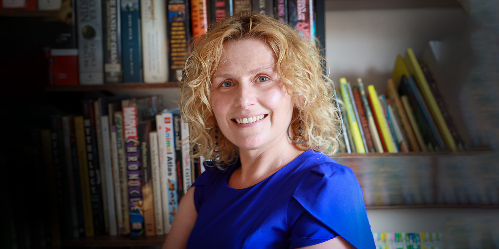 Teona Shainidze Krebs pictured in front of a book shelf