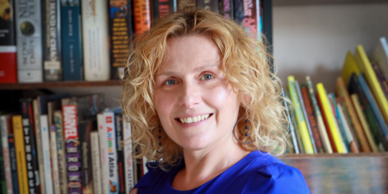Teona Shainidze Krebs pictured in front of a book shelf