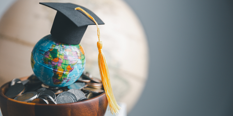 Globe with Graduation hat resting on top of it