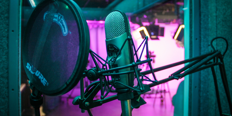 A professional microphone setup in the sound booth at Studio21c.