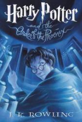 A boy with glasses and a wand in his hand looks over his shoulder.