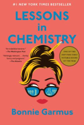 Pink cover with blue letters and a picture of a woman in sunglasses