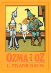 Orange cover with a tin man, a little girl, and a scare crow