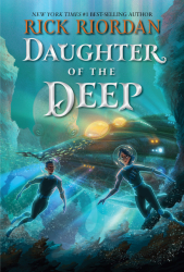 Underwater scene with two scuba divers and white letters
