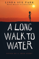 an orange and black cover with a person walking