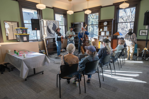 A group of people watching a concert at the Manitou Springs Open House