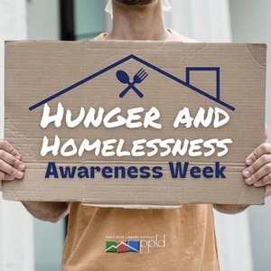 Hunger and Homelessness Awareness Week 2022 A person holding a cardboard sign that reads "Hunger and Homelessness Awareness Week."