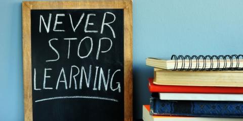 Never Stop Learning written on a chalkboard