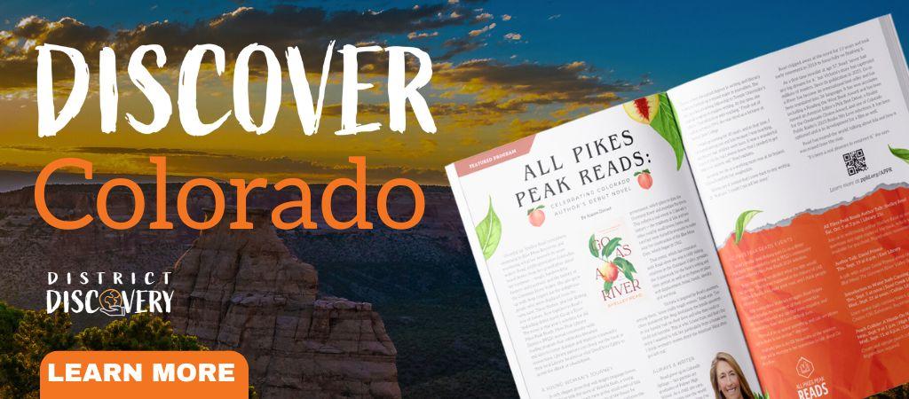 A backdrop of Colorado and a magazine spread opened up with the words "Discover Colorado"