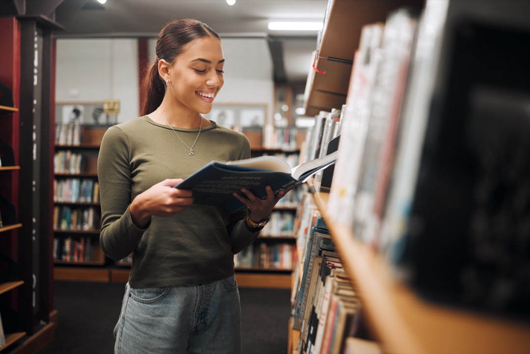 Women Reading a book in a library